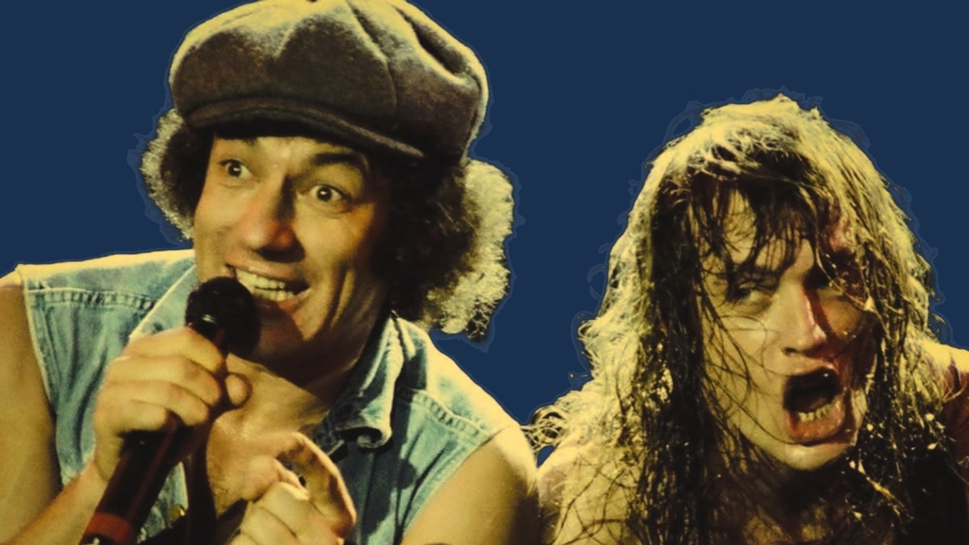 Brian Johnson e Angus Young do AC/DC durante apresentação ao vivo, com expressões intensas e iluminação dramática.