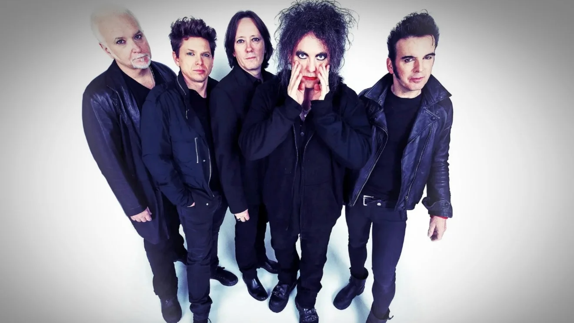 Integrantes do The Cure em foto promocional do álbum Songs of a Lost World.