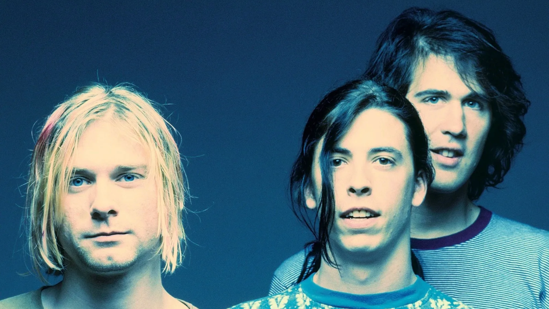 Integrantes do Nirvana em foto promocional de 1991, durante a era do álbum Nevermind.