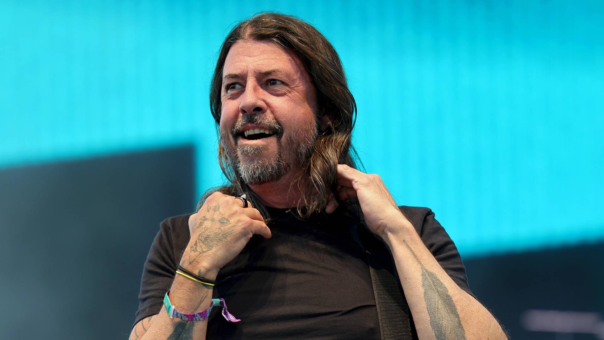 Dave Grohl durante apresentação ao vivo; músico afirmou que os Beatles são a banda ideal para crianças aprenderem música